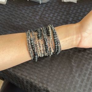 1277- stack of 4 beaded coiled bracelets in blue, black and silver